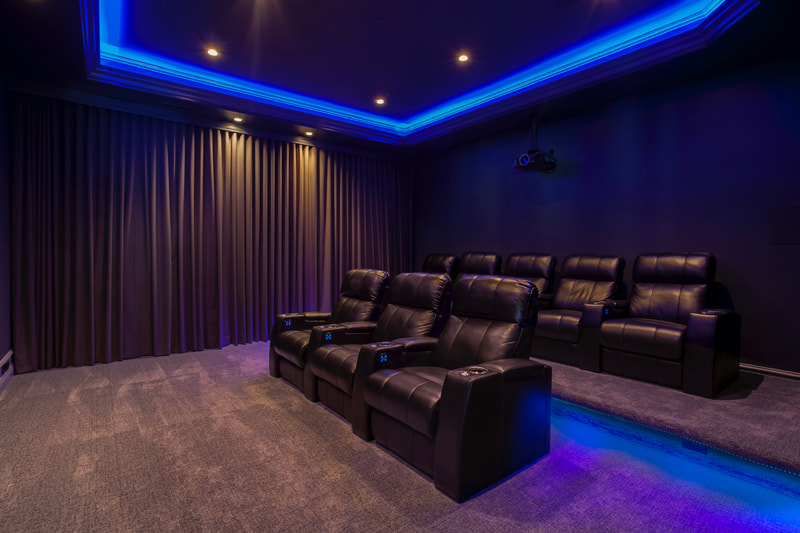 Seating and lighting in custom home theater
